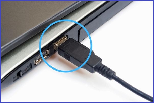 faulty usb cable connected to a laptop