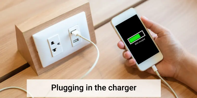 Plugging in the charger